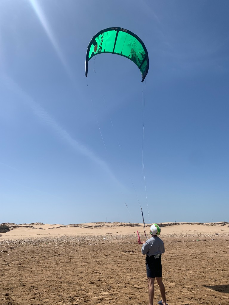 Smiling kitesurf students in helmets and GUL vests at Essaouira kite school