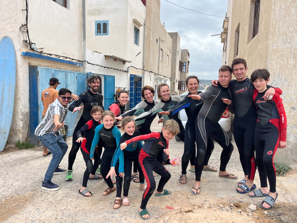 Surf group in wetsuits at Essaouira Surf School before a beach session